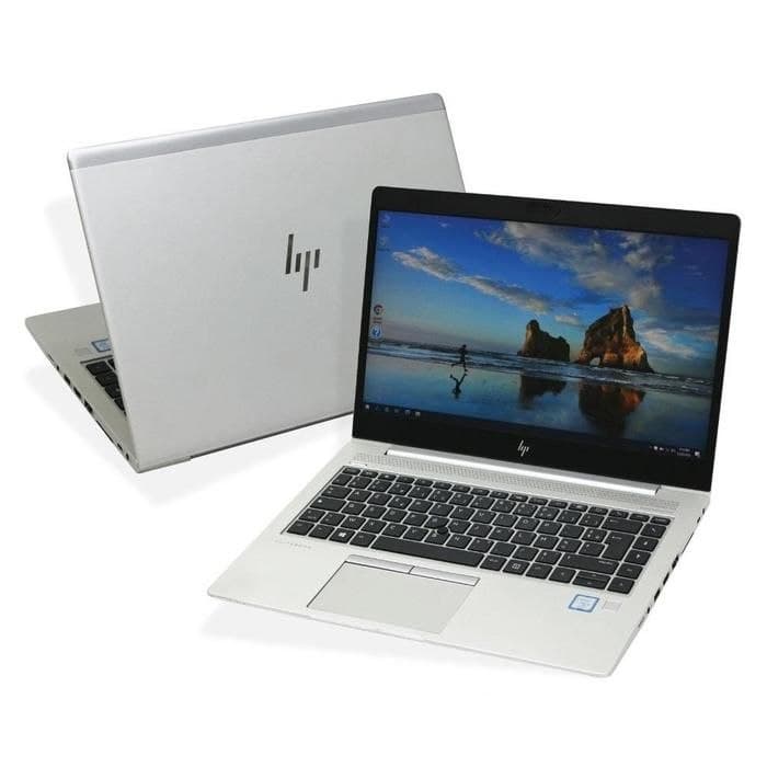 Ноутбук HP EliteBook 830 G6 с открытым экраном и клавиатурой, рядом видна задняя крышка ноутбука.