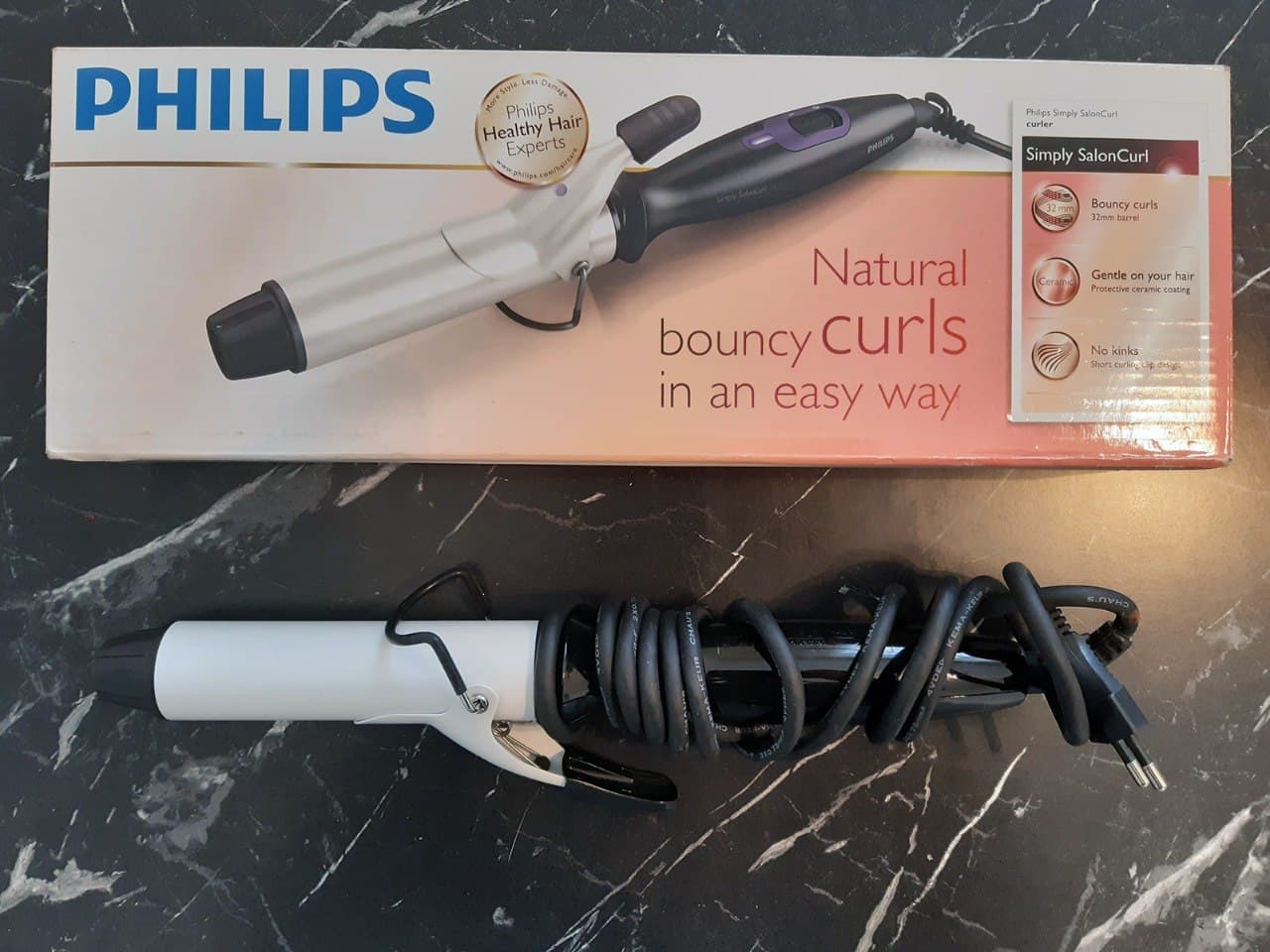 Щипцы для завивки Philips HP8600/40 с керамическим покрытием и коробка устройства.